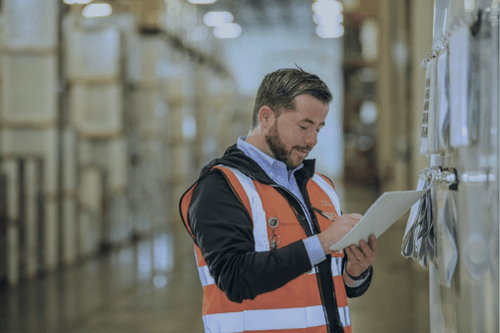CDS 3rd Party Warehouse Inventory Tracking Person Reviewing sheet