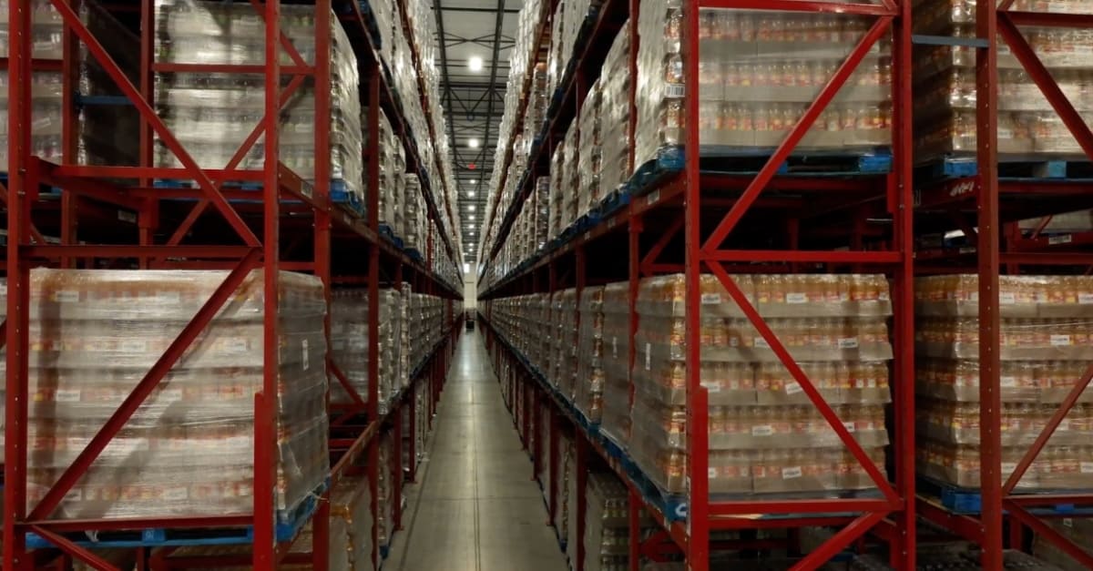 Fulfillment warehouse filled with food and beverage products stacked on shelves