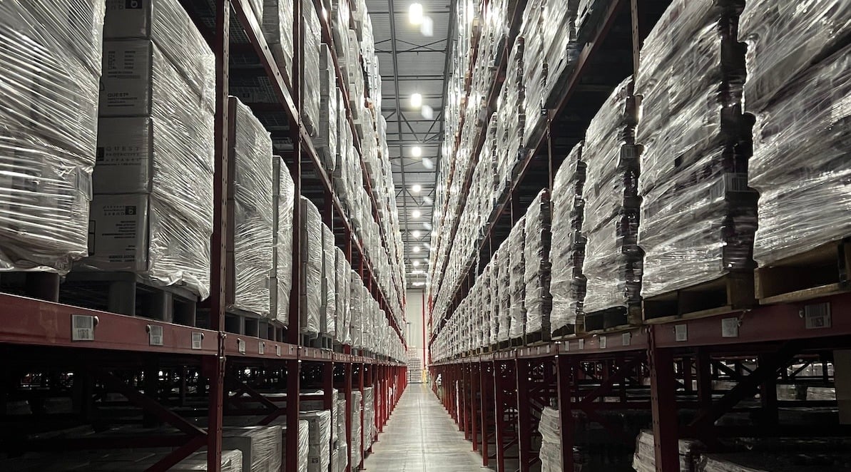 health and beauty products stacked on shelves in a distribution warehouse